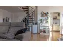 Wohnbereich mit Treppe ins Dachgeschoss
